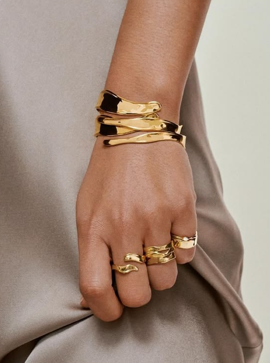 Gold Stacked Rings and Wave Cuff Bracelets